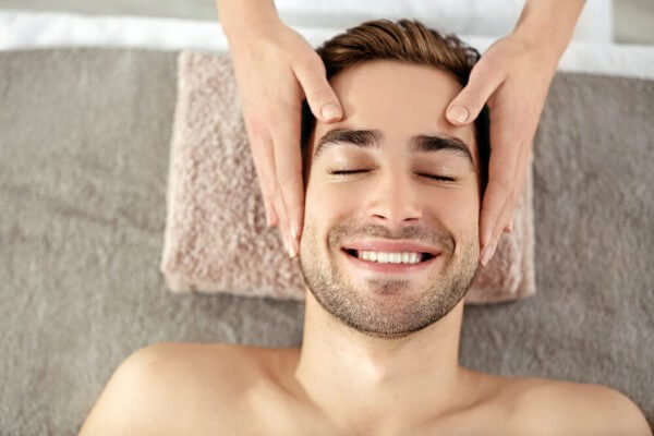 Male getting massage and facial