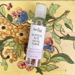 Reviva Glycolic Acid Toner on a flowered background