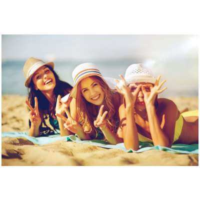 three young woman on beach