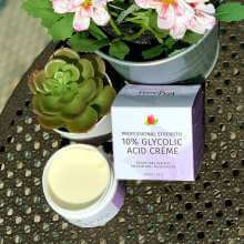 10% Glycolic acid creme open on table in the sun