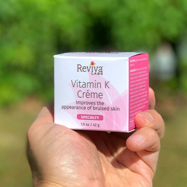 vitamin k creme box held in hand