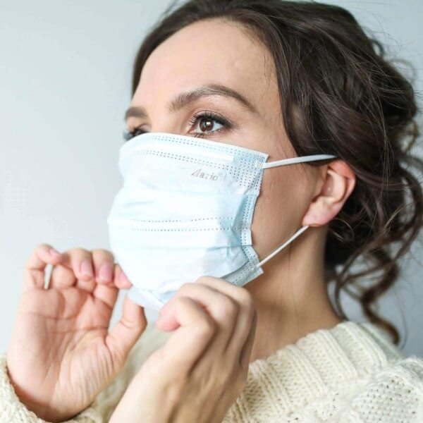 woman in white face mask