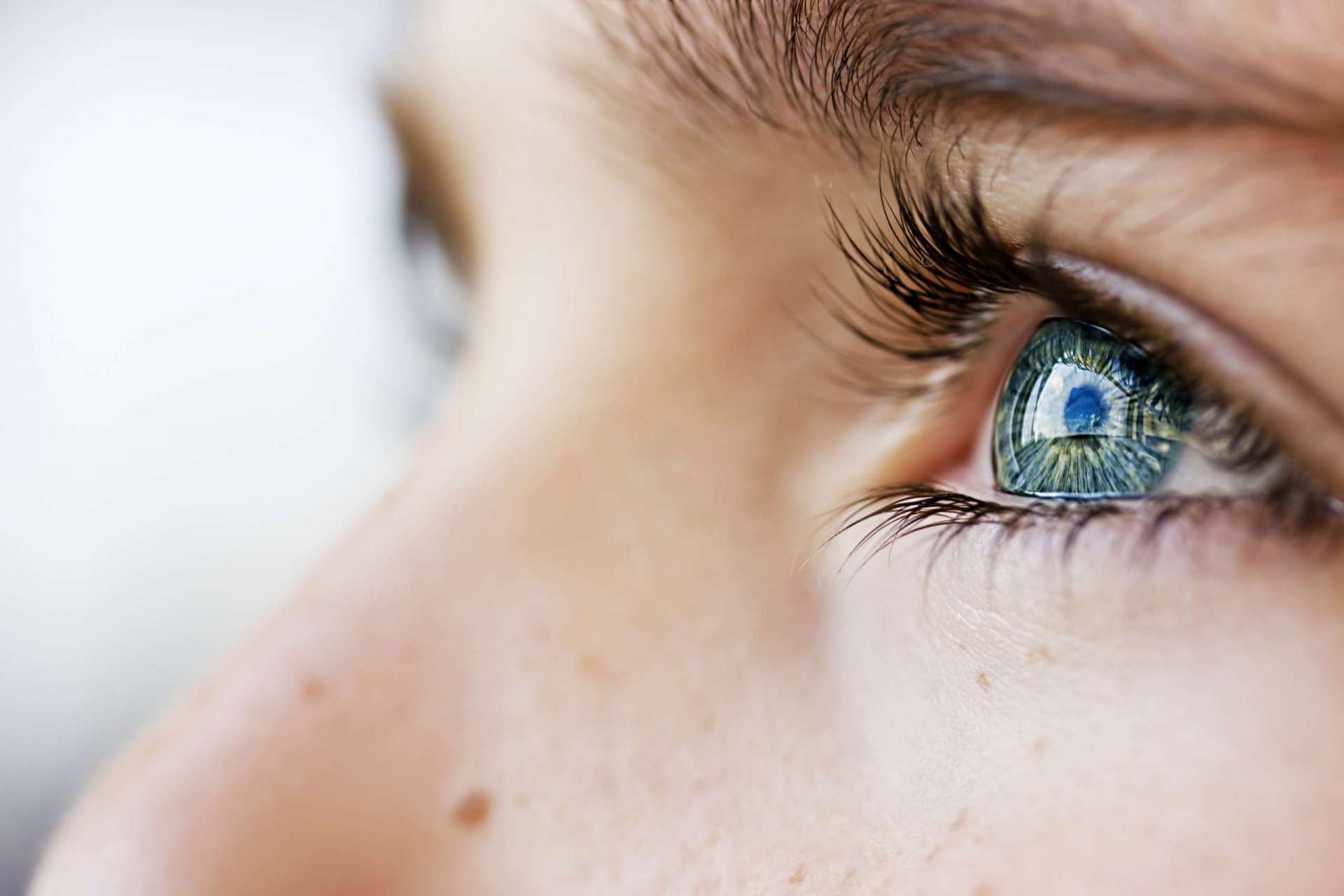 close up of blue green female eye