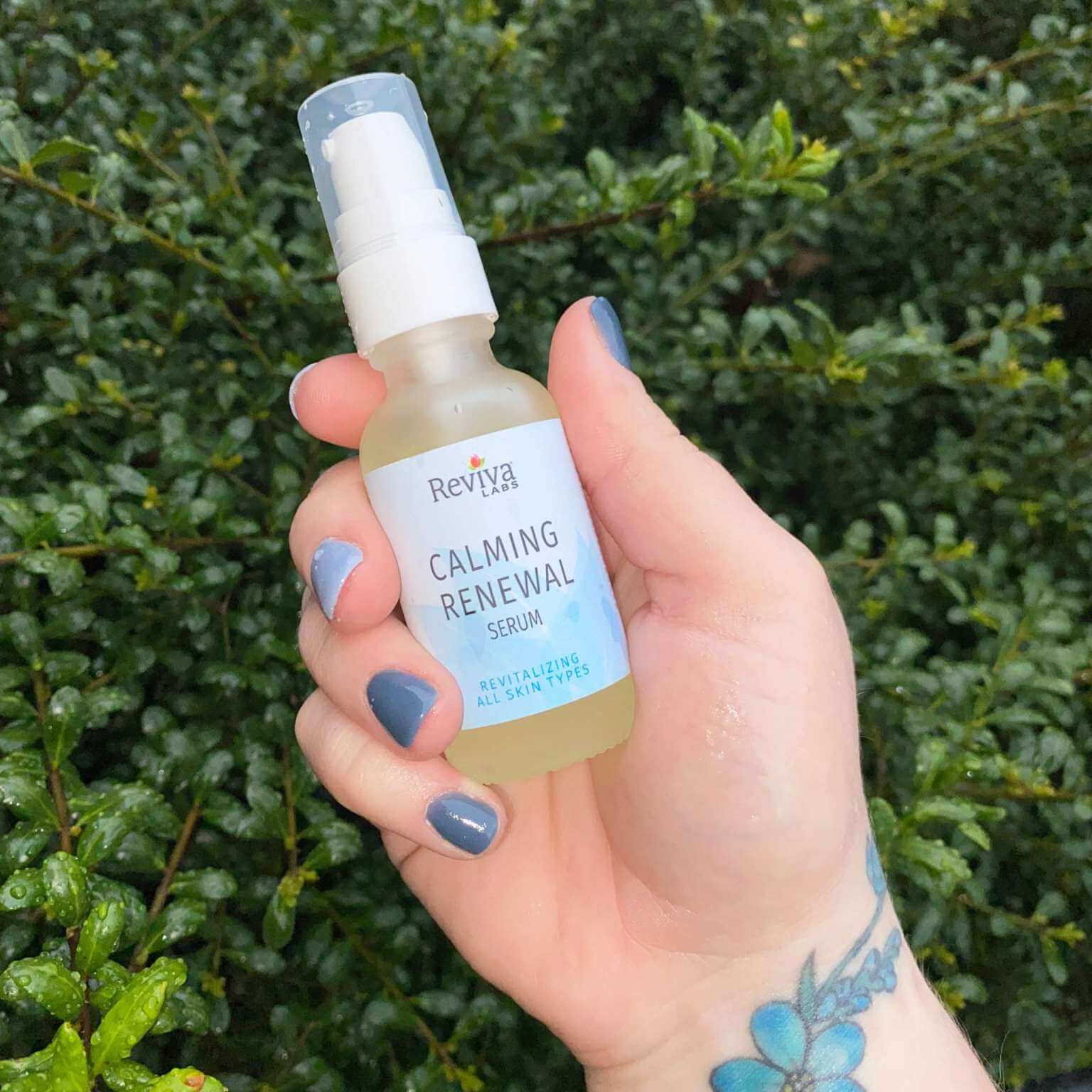 hand holding calming renewal serum