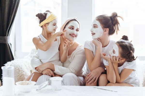 mom with daughter using skin care masks