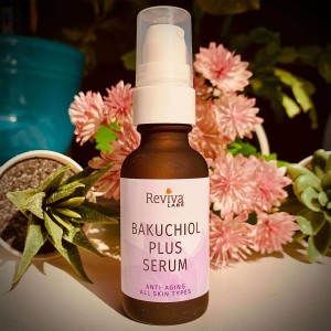 988 Bakuchiol Plus serum in front of flowers