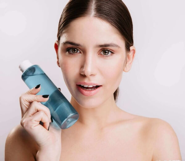 Female holding toner