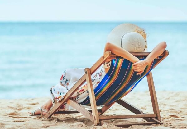 Lounging in a beach chair by the ocean