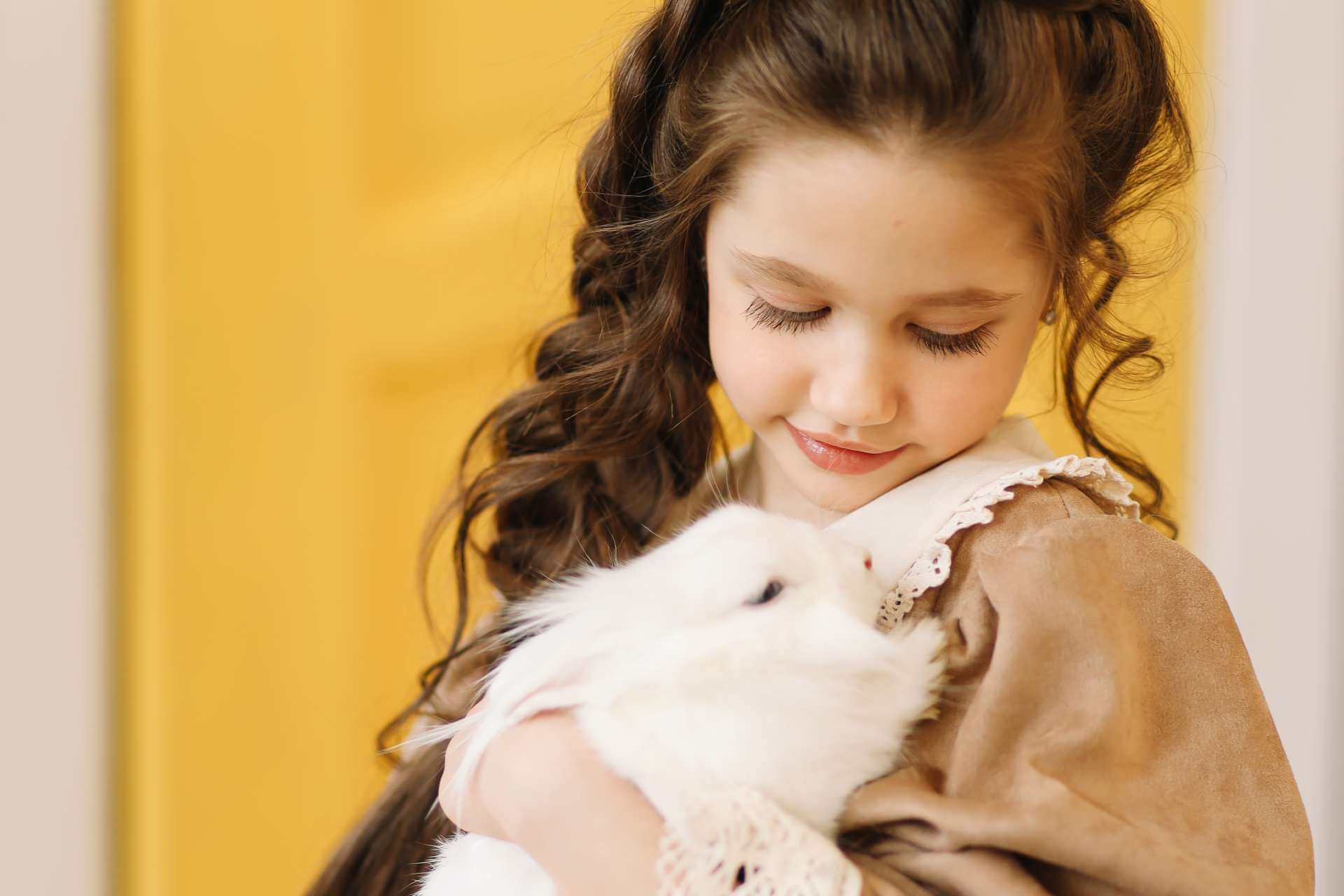 Bunny hug young girl in yellow