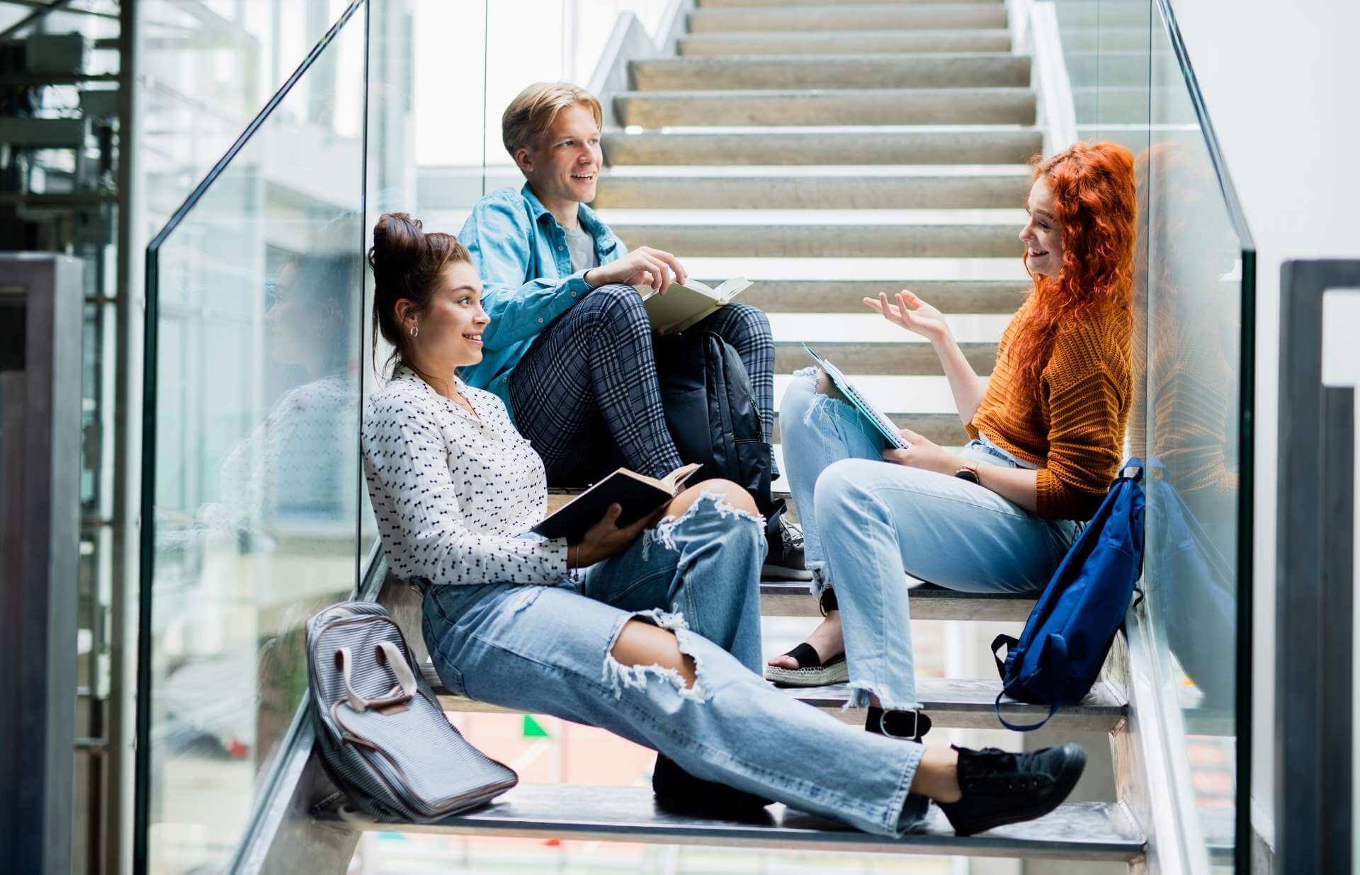 university-students-sitting-on-stairs-and-talking-2022-01-18-23-33-47-utc