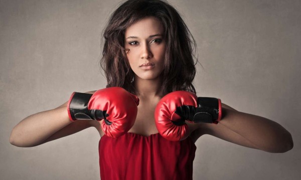 woman boxer in boxing gloves