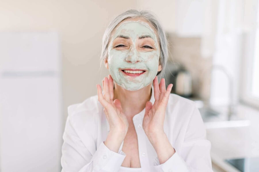 caucasian elderly woman with mud facial mask smil 2022 05 11 01 38 52 utc