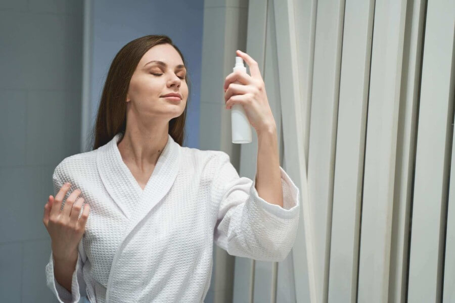 woman holding a bottle of cosmetic product 2021 09 03 15 41 12 utc