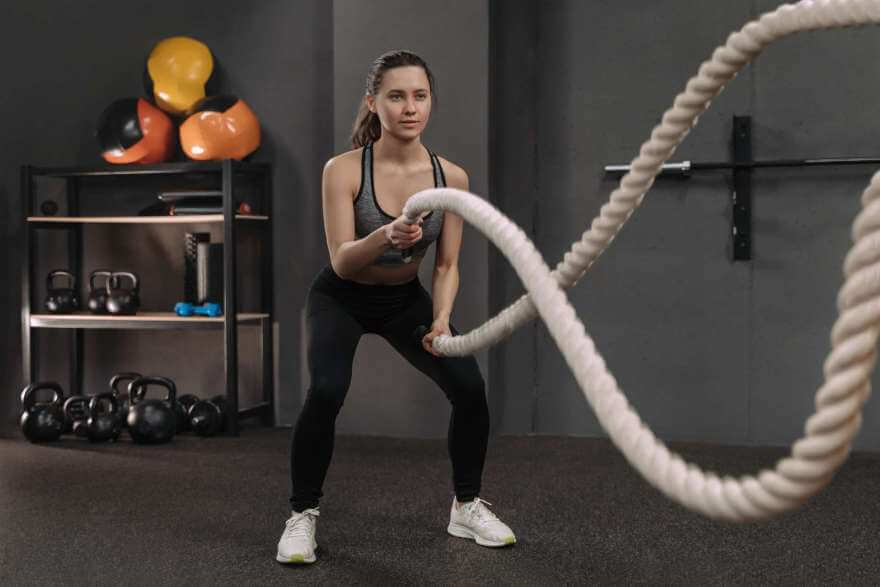 sportswoman working out with battle ropes in funct 2023 05 04 23 20 44 utc