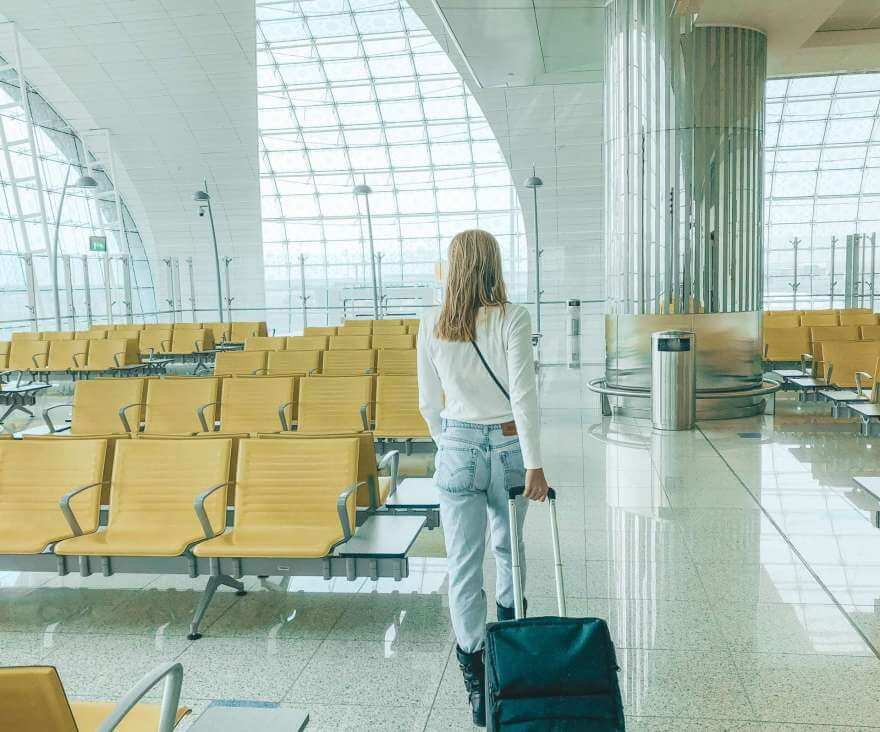 view from behind woman walking through the airport 2022 11 15 02 15 01 utc