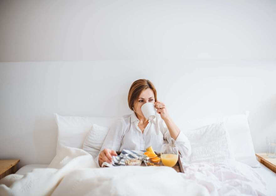 a front view of woman having breakfast in bed in t 2022 02 02 05 09 46 utc