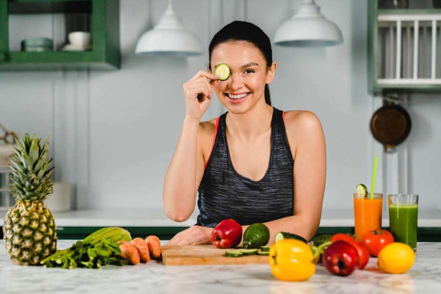 happy caucasian girl holding cucumber piece sittin 2022 07 05 14 19 54 utc