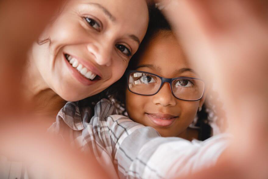 mom and daughter taking making selfie photo together for social media online.motherhood concept