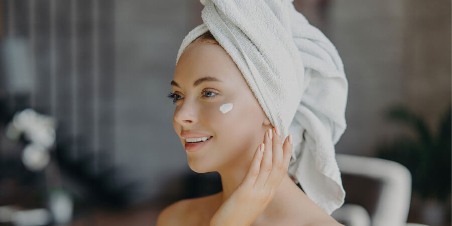 young woman enjoys post shower skincare applies c 2023 06 13 06 01 23 utc