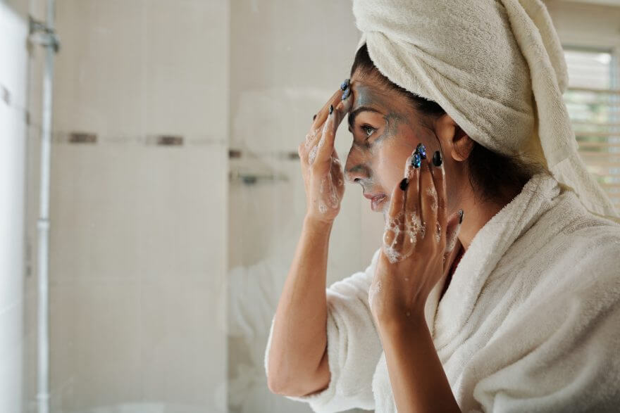 young woman washing face