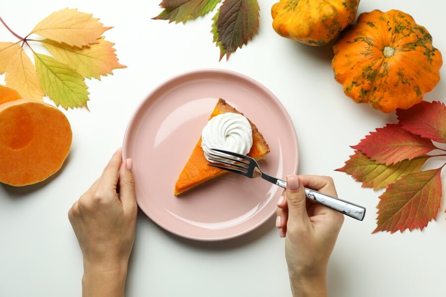 concept of tasty eating with pumpkin pie on white background