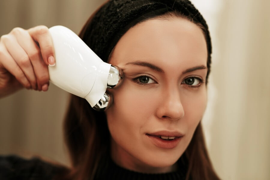 facial skin care. woman doing a facial massage