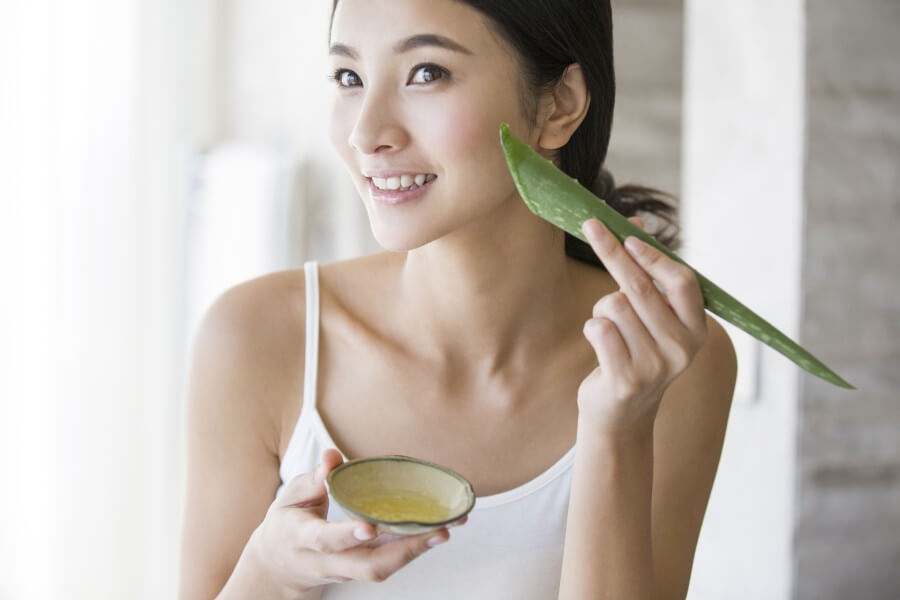 young chinese woman with natural aloe vera