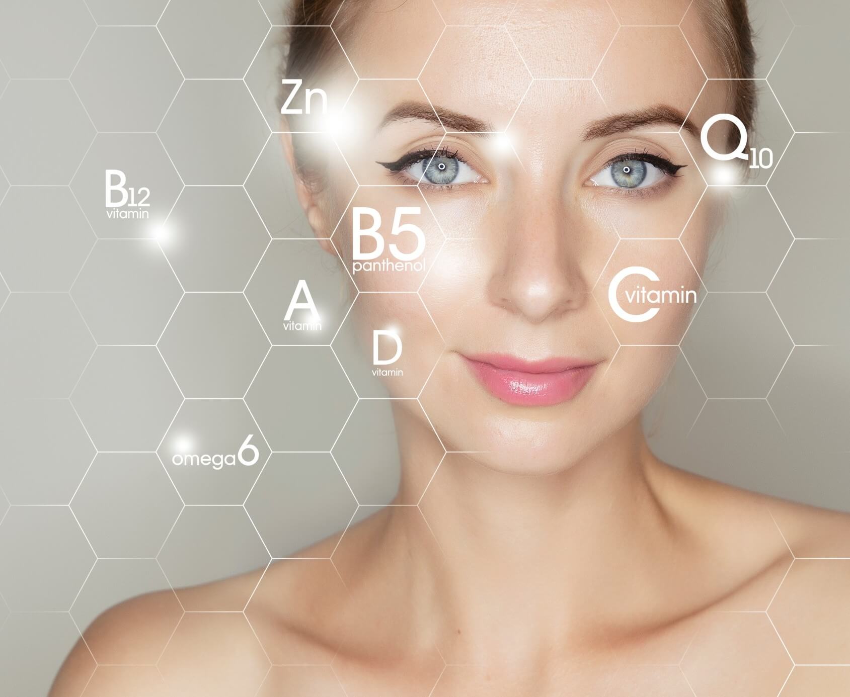 woman face portrait with graphic icons of vitamins and minerals for skin treatment