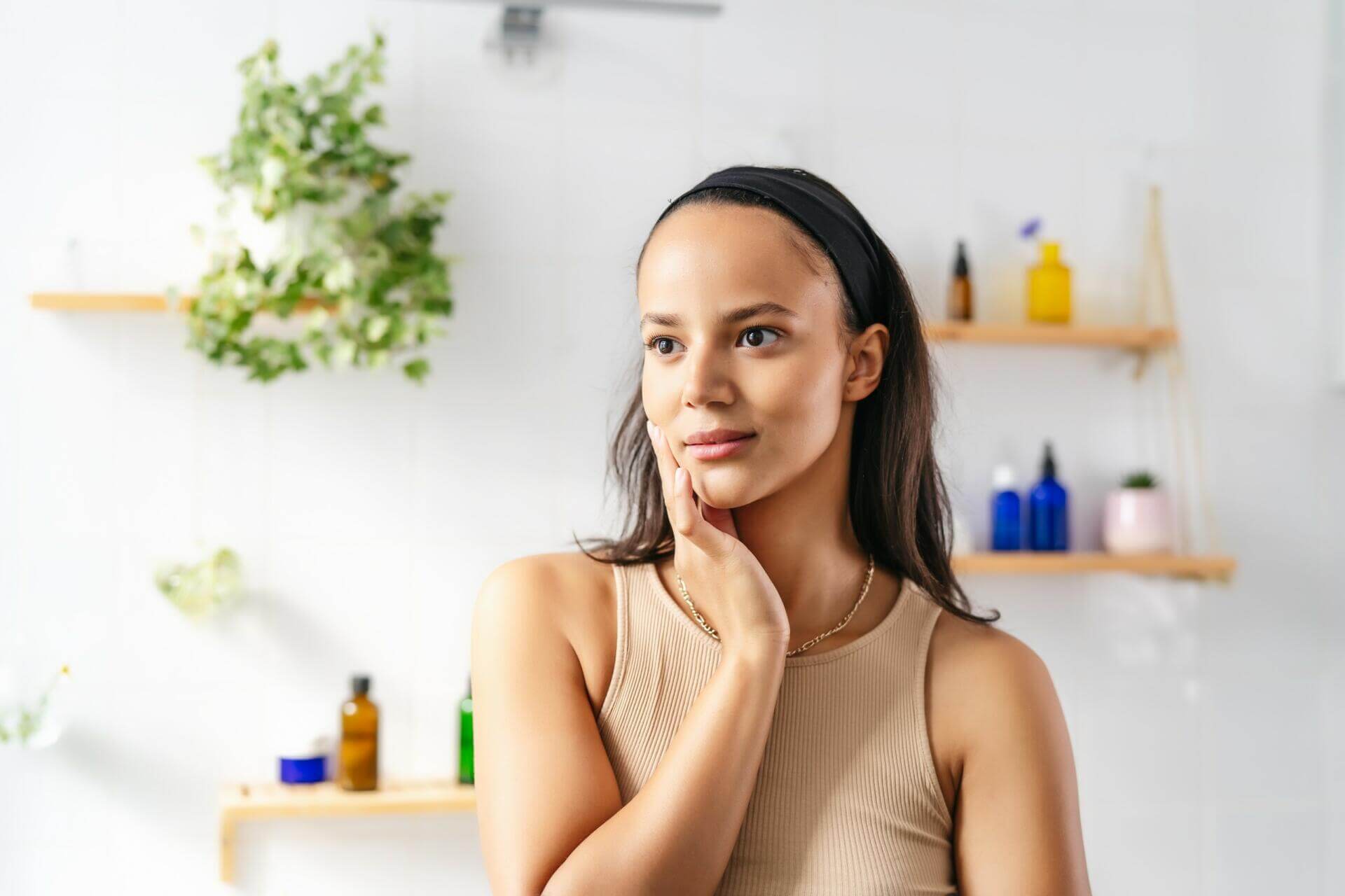 beautiful hispanic brunette on cosmetic background