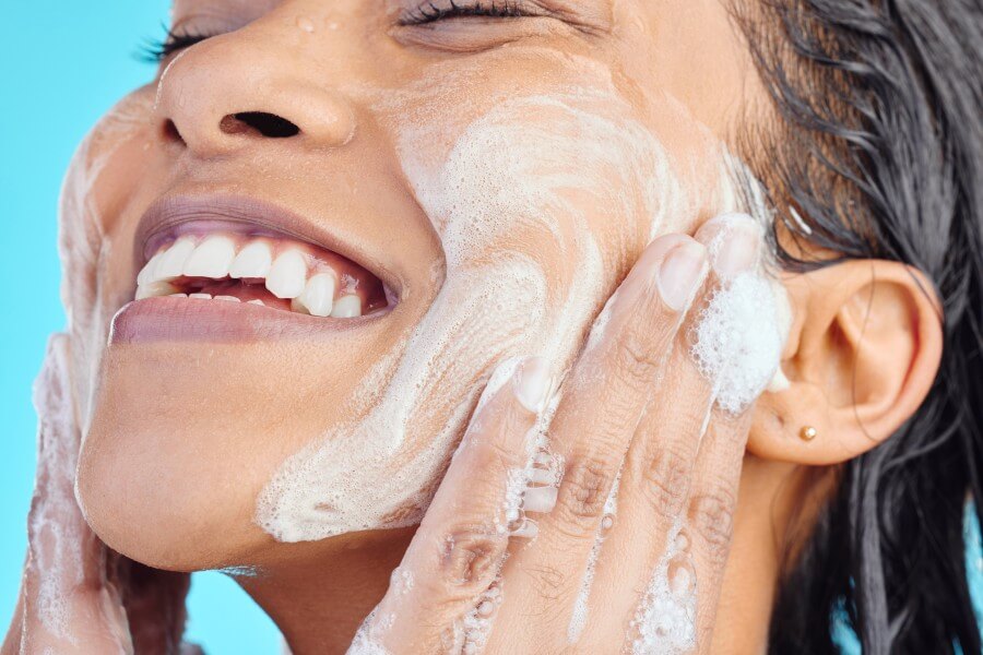 studio shot of a young woman washing her face whil 2023 11 27 04 49 59 utc