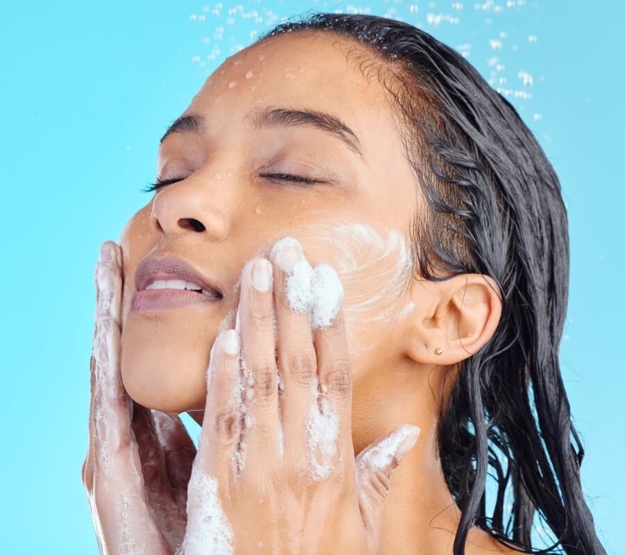 studio shot of a young woman washing her face whil 2023 11 27 05 08 03 utc