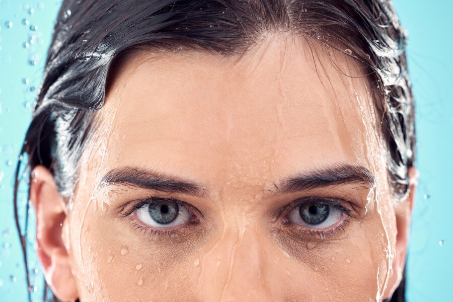 water splash skincare and eyes of woman in shower 2023 11 27 05 11 24 utc