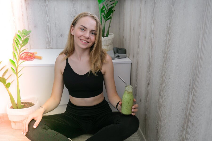 young millenial blond woman drinking vegan smoothi 2023 11 27 05 20 54 utc