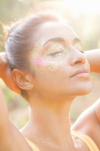 model wearing glitter over eyes and cheeks