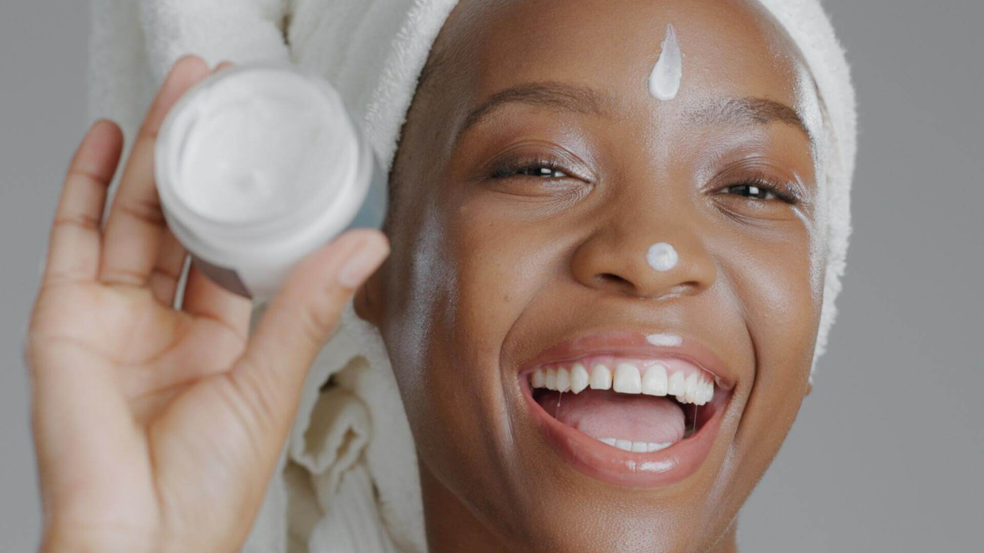 woman moisturizer and smile in portrait closeup f 2023 11 27 05 11 59 utc