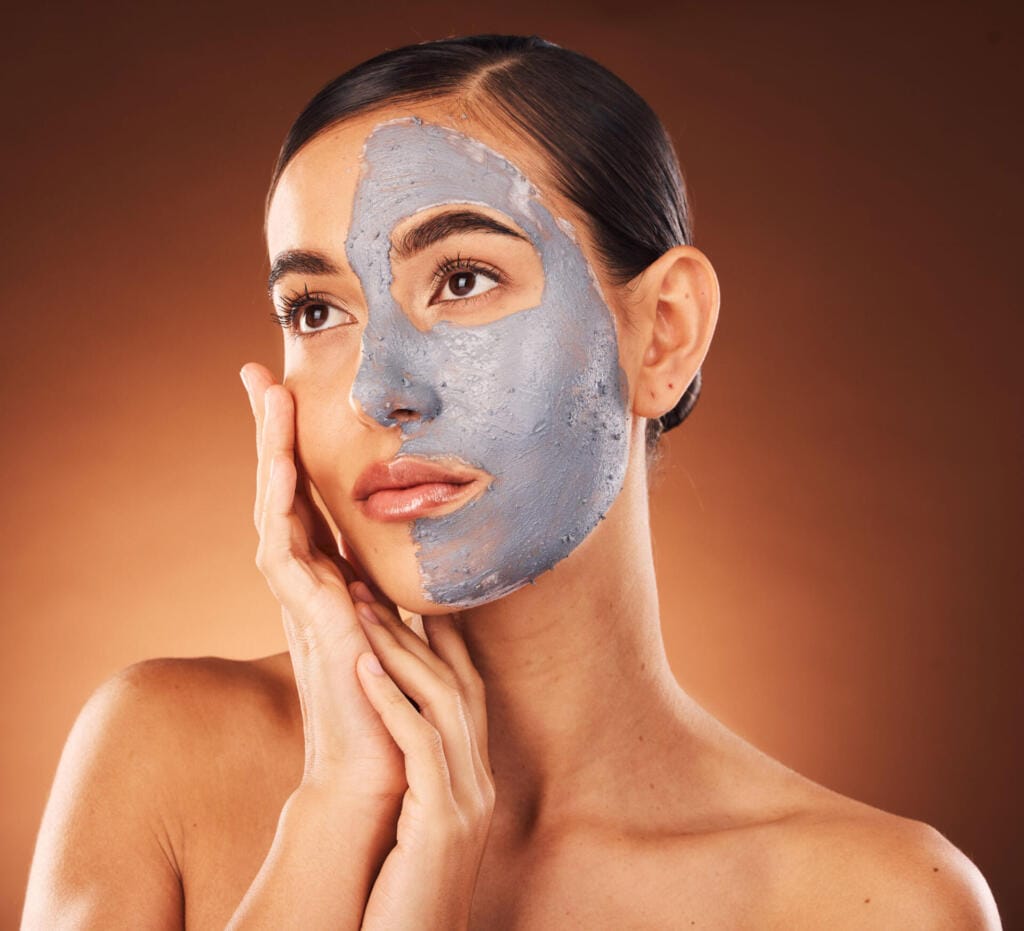 woman face skincare and mud mask on orange backgr 2023 11 27 05 33 05 utc