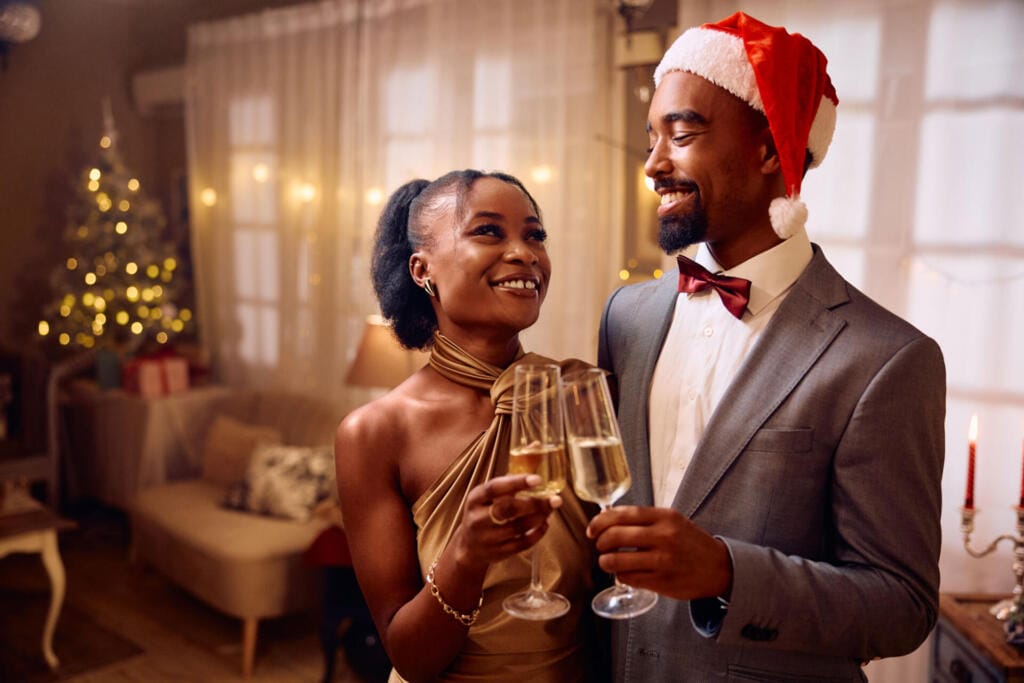 happy black couple toasting with champagne on new 2023 11 27 05 05 18 utc