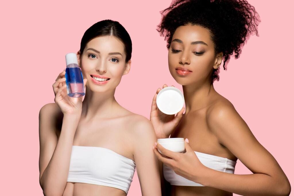 happy multiracial women holding cosmetic cream and 2024 11 01 03 29 48 utc