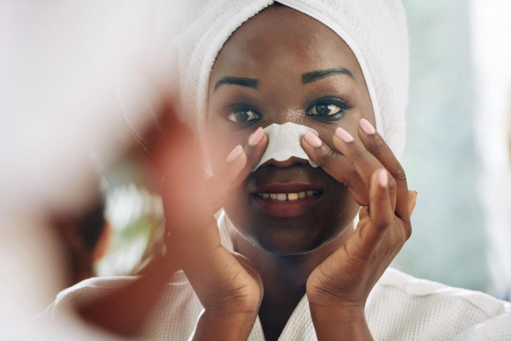 woman applying nose pore strip 2023 11 27 05 15 41 utc