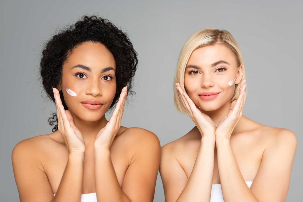 multiethnic women with cosmetic cream on faces loo 2024 11 10 22 37 25 utc