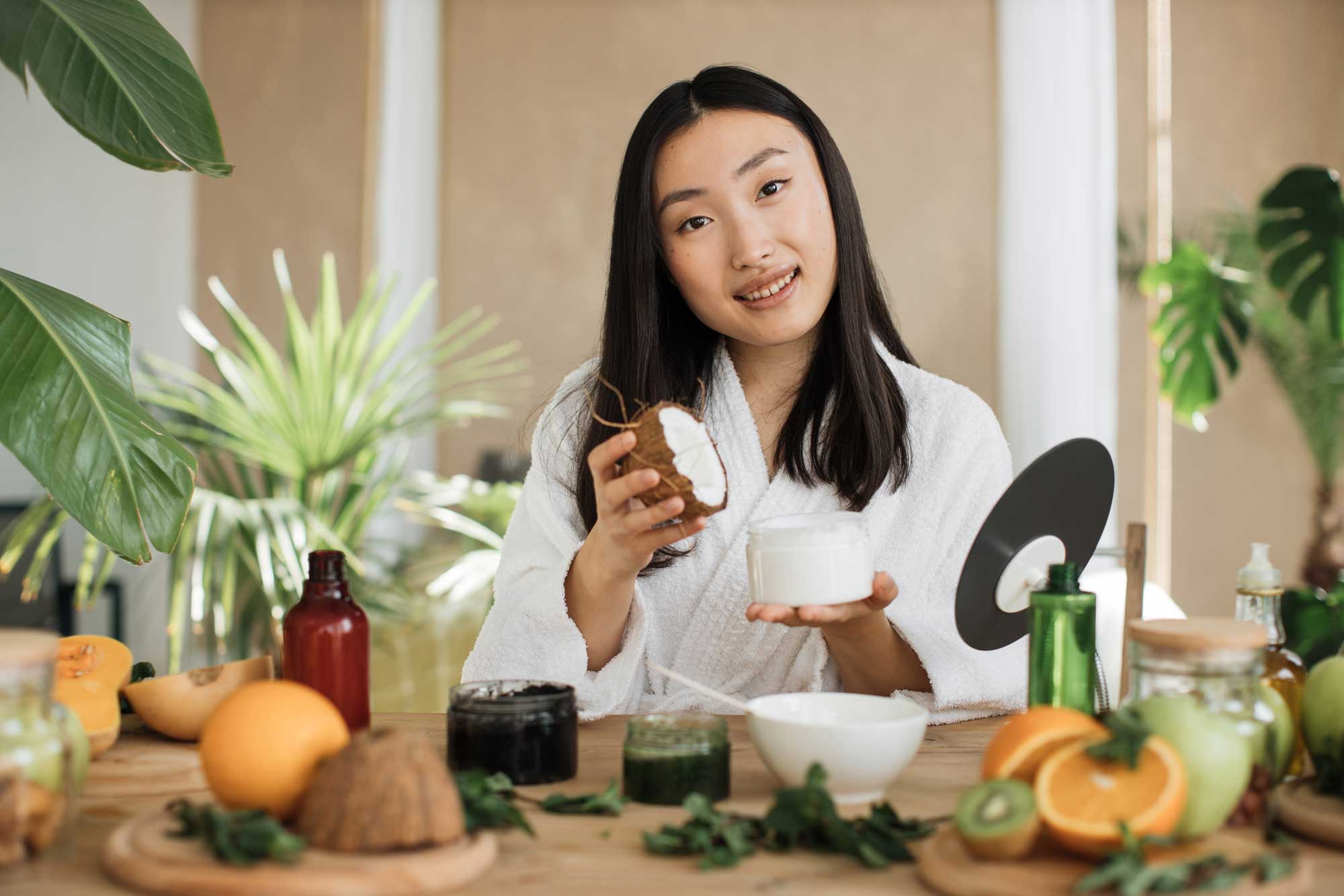 young asian woman holding half of coconut and maki 2024 12 13 09 14 26 utc