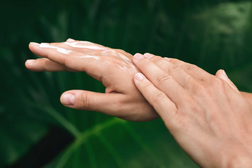 close up of female hands applying nourishing cream 2024 10 18 03 38 43 utc