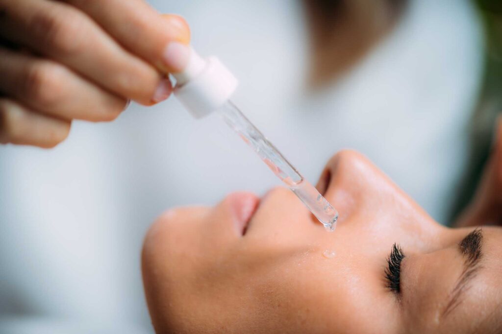 cosmetician applying hyaluronic acid serum on woma 2024 10 21 00 03 32 utc