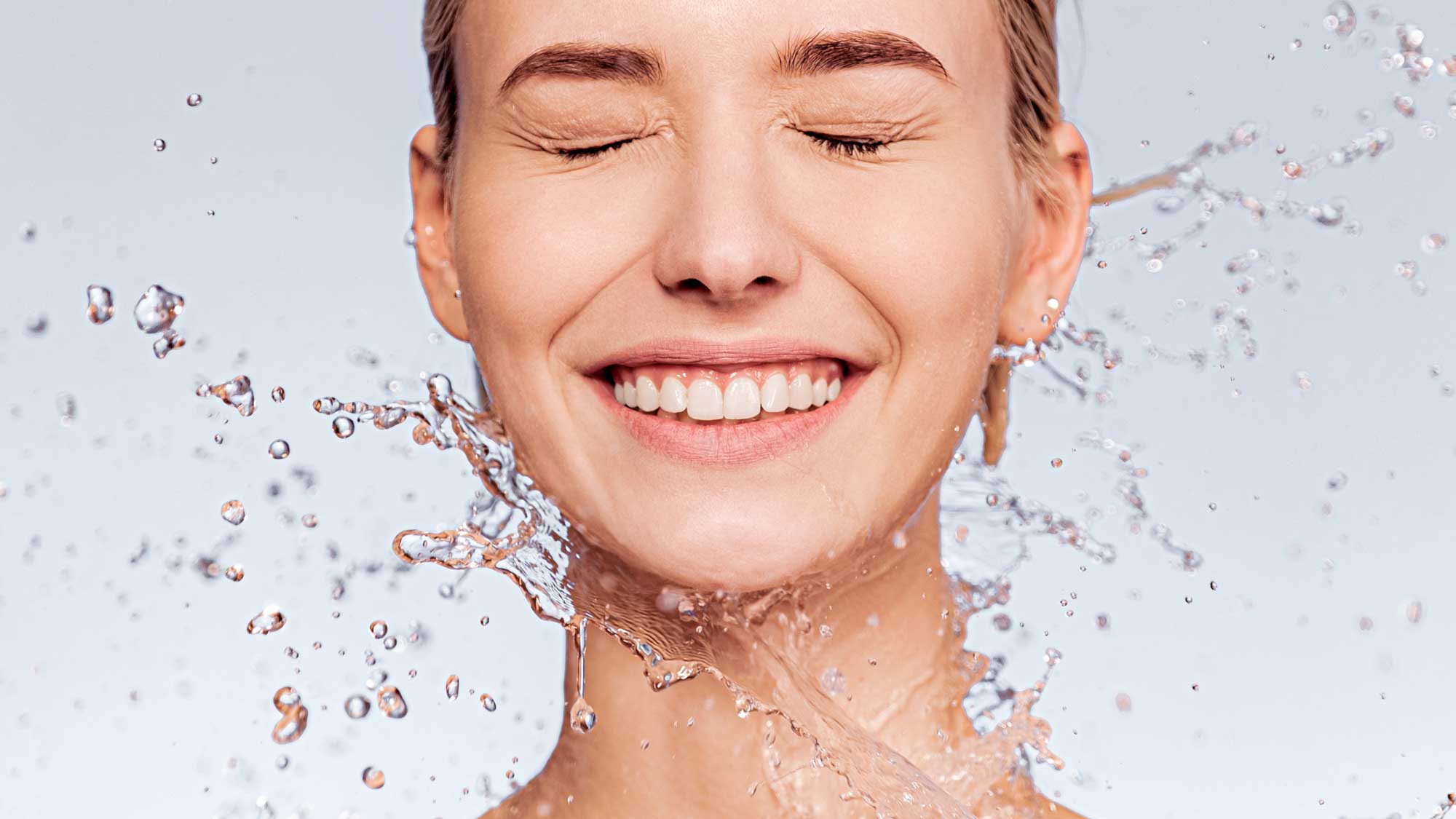 portrait of smiling woman with drops of water arou 2024 11 28 11 49 37 utc